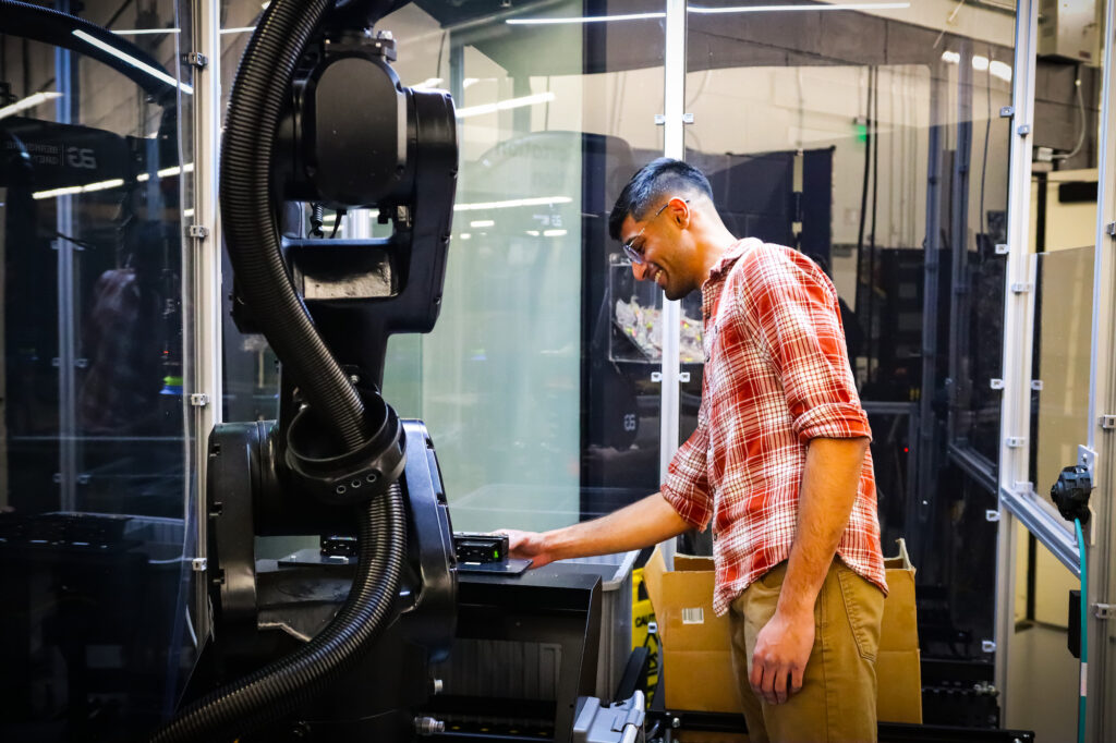 Berkshire Grey Employee calibrating a robot